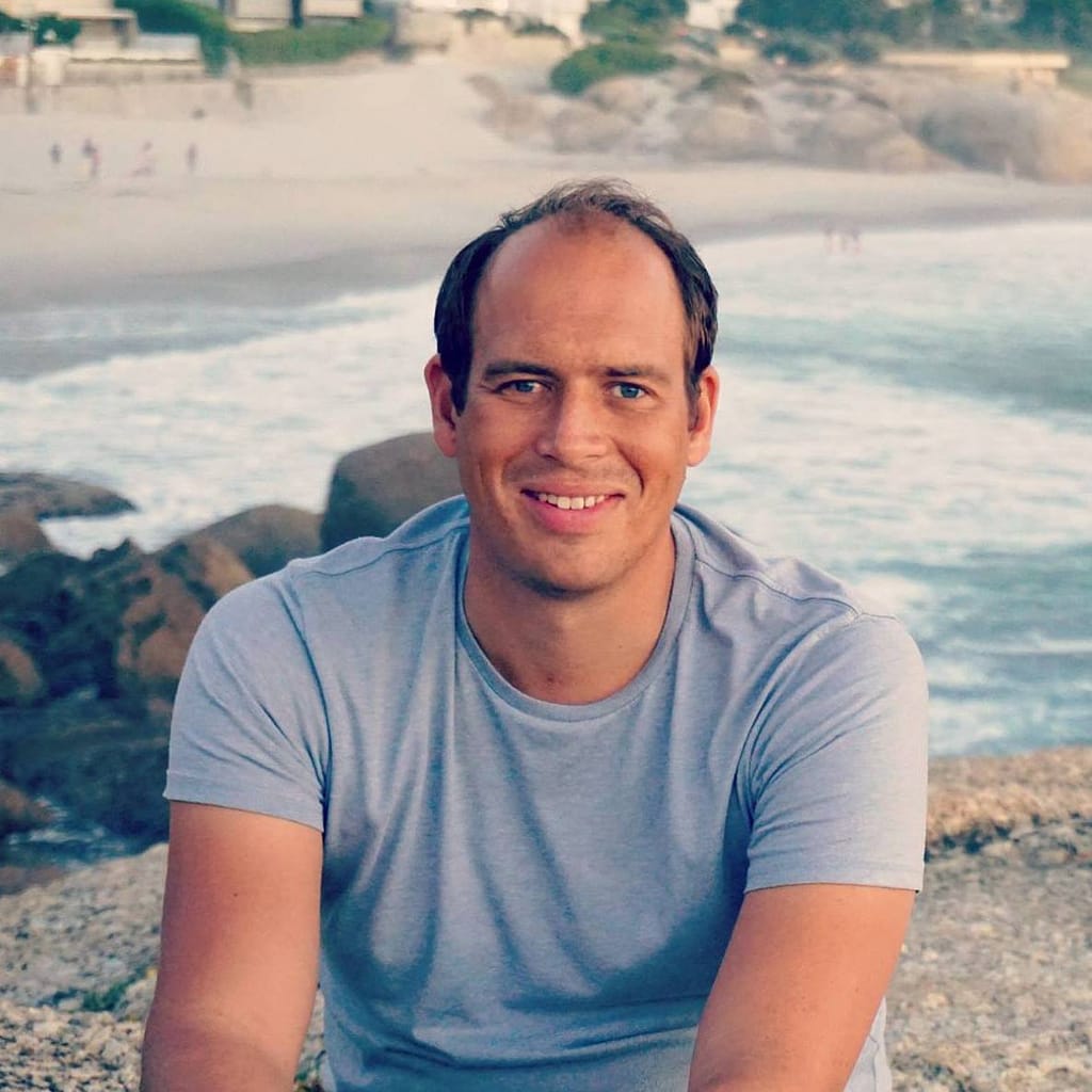 guy headshot with beach in the background
