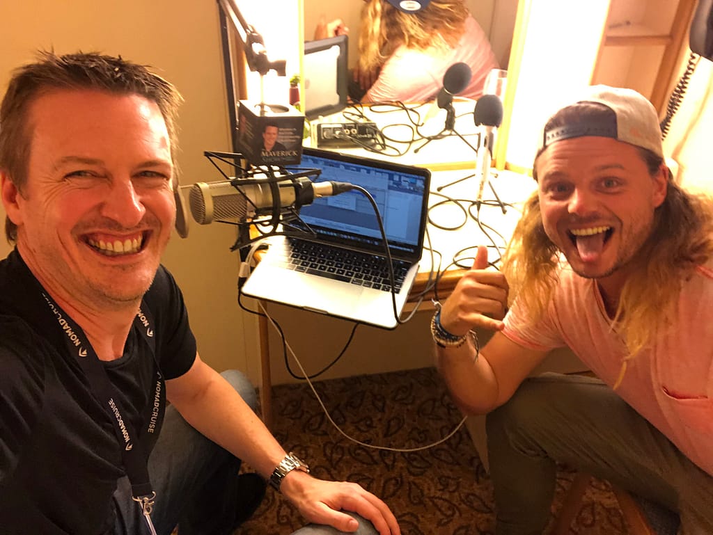 Nick Martin and Matt smiling with a podcast setup
