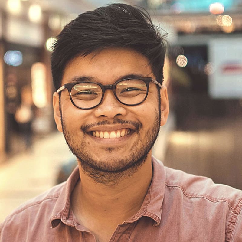 headshot photo of a man smiling